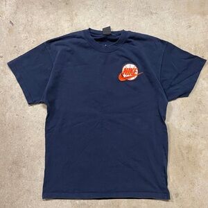 Nike Men's Dark Blue Tee with Orange Logo